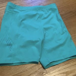 Light green/teal womens biker shorts. Never worn. Size medium.